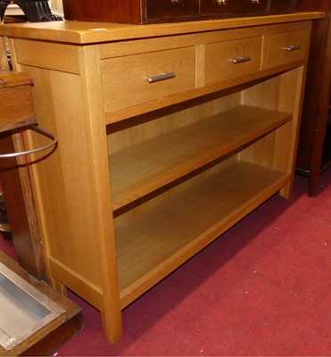 Lot 1442 - A contemporary blond oak two-tier open shelf...