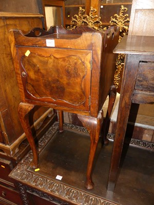 Lot 1447 - A walnut single door pot cupboard, with...