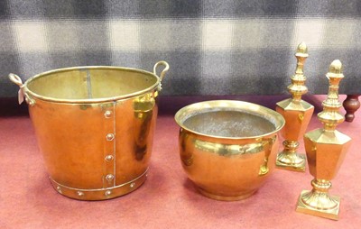 Lot 571 - A riveted and polished brass twin handled log...