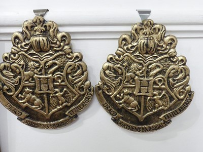 Lot 420 - A pair of reproduction cast metal Hogwarts...