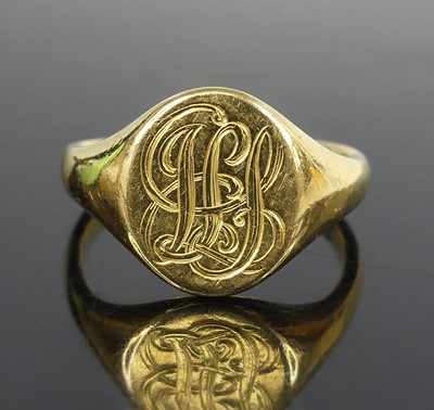 Lot 2508 - An 18ct yellow gold oval signet ring, engraved...