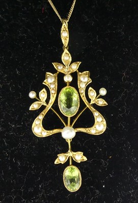 Lot 2516 - An Edwardian yellow metal openwork peridot and...