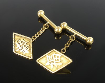 Lot 2514 - A pair of yellow metal cufflinks, each having...