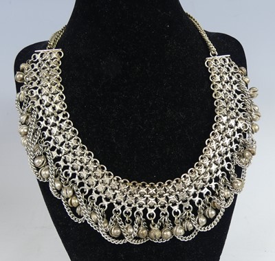 Lot 2548 - An African white metal multi-strand necklace,...