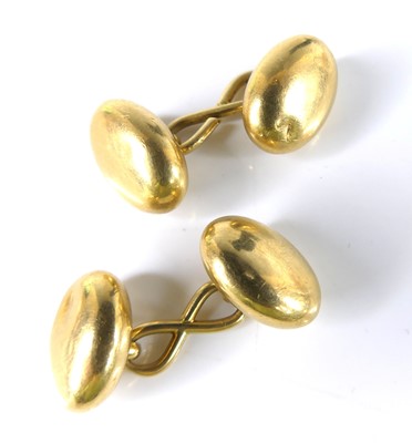 Lot 2567 - A pair of yellow metal oval domed double-ended...