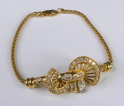 Lot 2575 - A yellow metal tubular meshlink bracelet, with...