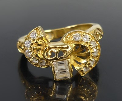 Lot 2576 - A yellow metal dress ring, having curved...