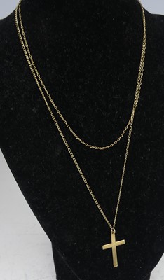 Lot 2572 - A yellow metal plain cross pendant and two...