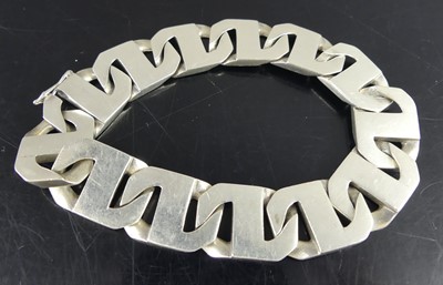 Lot 2580 - A white metal heavy metric curblink bracelet,...