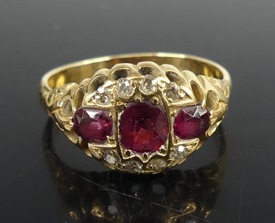 Lot 2582 - A yellow metal ruby and diamond triple cluster...