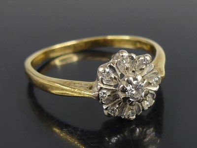 Lot 2583 - An 18ct yellow and white gold diamond circular...