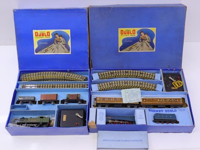 Lot 390 - Two Hornby Dublo 3 rail sets, both with early...
