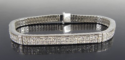 Lot 2608 - A white metal diamond set bracelet, comprising...