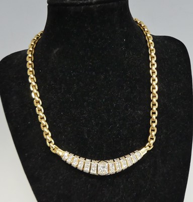 Lot 2612 - An 18ct yellow gold diamond necklet, having...