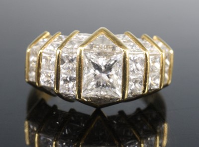 Lot 2614 - An 18ct gold and diamond half-hoop ring,...
