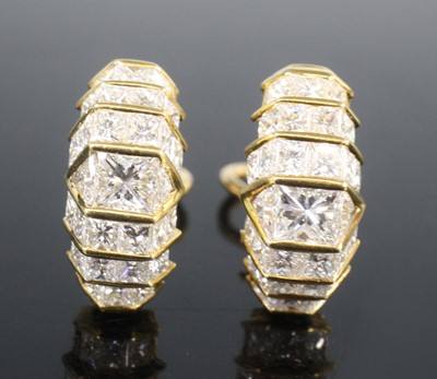 Lot 2615 - A pair of 18ct gold diamond earrings, of...
