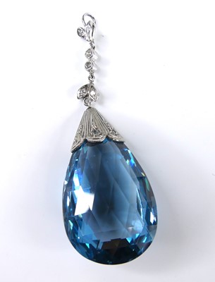 Lot 2634 - An Art Deco white metal blue paste set pendant,...