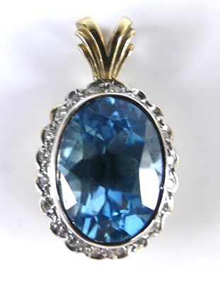 Lot 2639 - A 9ct yellow and white gold, blue topaz and...