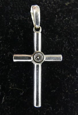 Lot 2643 - A 9ct white gold diamond cross pendant, the...