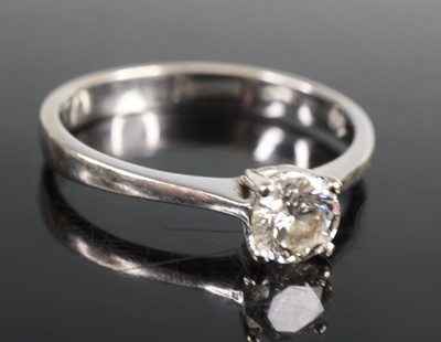 Lot 2649 - A white metal diamond solitaire ring,...