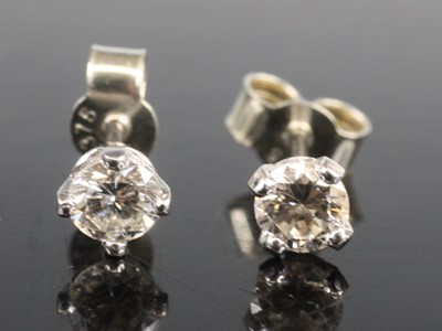 Lot 2659 - A pair of white metal diamond single stone...