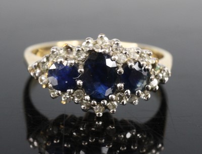 Lot 2661 - A 9ct yellow and white gold, sapphire and...
