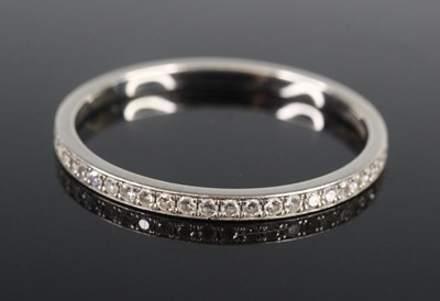 Lot 2663 - A platinum diamond eternity ring, having 52...