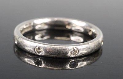 Lot 2664 - A platinum diamond 2.9mm court shaped band,...