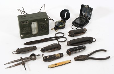 Lot 253 - An ammunition tin containing various items to...