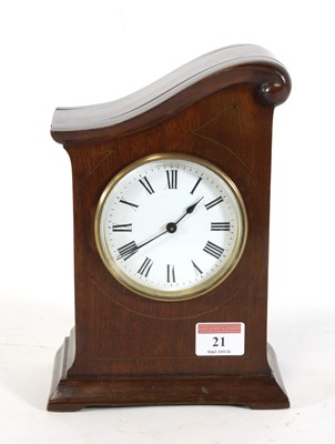 Lot 21 - An Edwardian mahogany cased mantel clock, the...