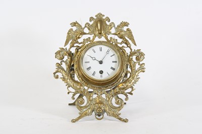 Lot 32 - A late 19th century French brass strut clock,...