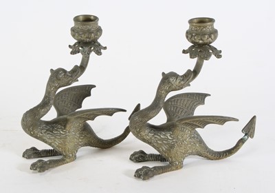 Lot 34 - A pair of brass table candlesticks in the form...