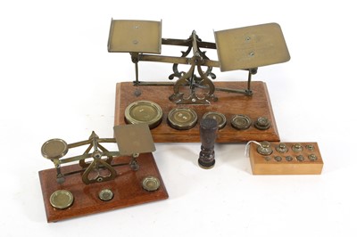 Lot 47 - A set of late 19th century brass postal scales,...