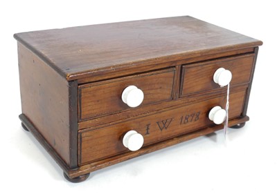 Lot 88 - A stained pine table chest, containing two...