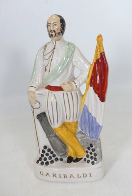 Lot 103 - A Staffordshire pottery flatback figure...