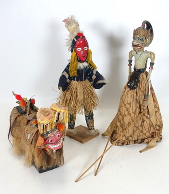 Lot 110 - An Indonesian carved and painted wooden puppet,...