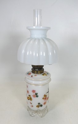 Lot 120 - A 19th century opaline glass oil lamp having a...