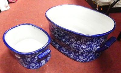 Lot 131 - A reproduction transfer decorated pottery foot-...