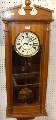 Lot 1139 - A beech droptrunk wall clock, having pendulum...