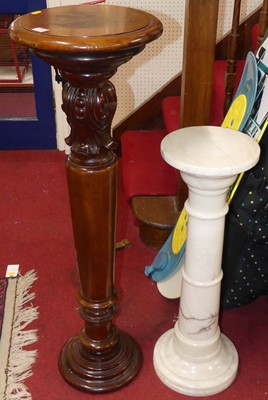 Lot 1128 - A turned mahogany circular pedestal sculpture...