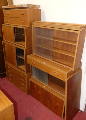 Lot 1155 - A collection of 1970s teak modular wall...