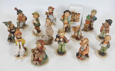 Lot 176 - A group of fourteen Hummel figures, the...