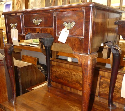 Lot 1188 - A George III mahogany three-drawer low boy, on...