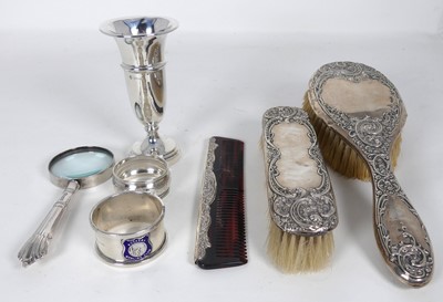 Lot 333 - A silver-backed hand brush, with matching...