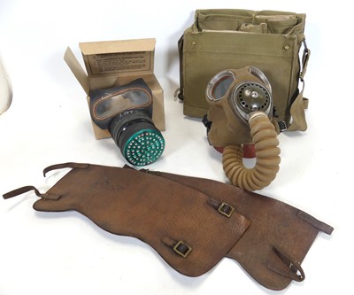 Lot 480 - A WWII period gas mask, in fitted green canvas...