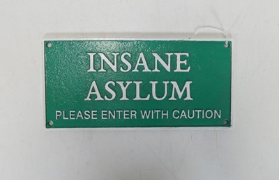 Lot 484 - A green & white painted cast iron Insane...