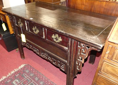 Lot 1205 - A Chinese stained hardwood three drawer altar...