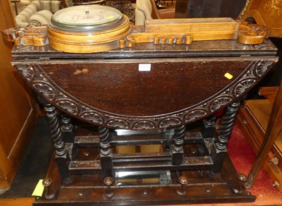 Lot 1214 - An early 20th century floral relief carved oak...