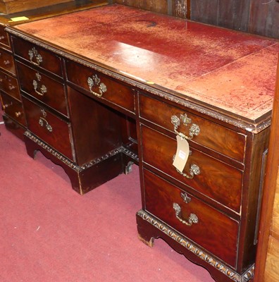 Lot 1217 - An early 20th century mahogany and gilt-tooled...