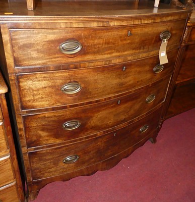 Lot 1232 - A Regency mahogany bowfront chest of four long...